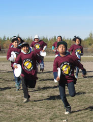 Group of children playing ultimate frisbee